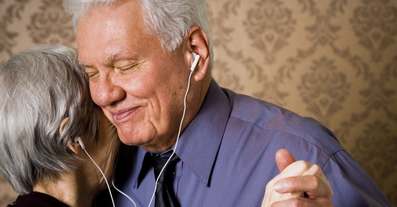 31 Mar 2006 --- Profile of an elderly couple dancing and listening to music --- Image by © Rubberball/Corbis