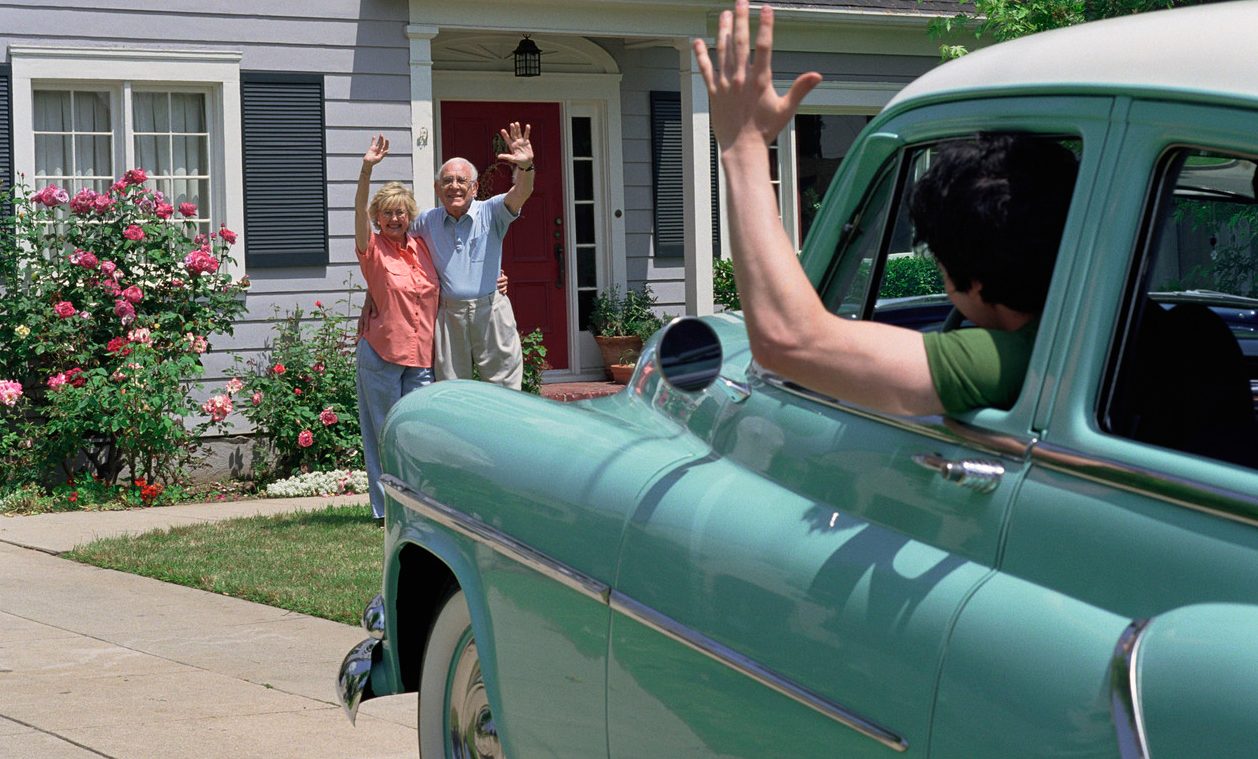 Waving Goodbye to Departing Car --- Image by © 68/Verity Jane Smith/Ocean/Corbis