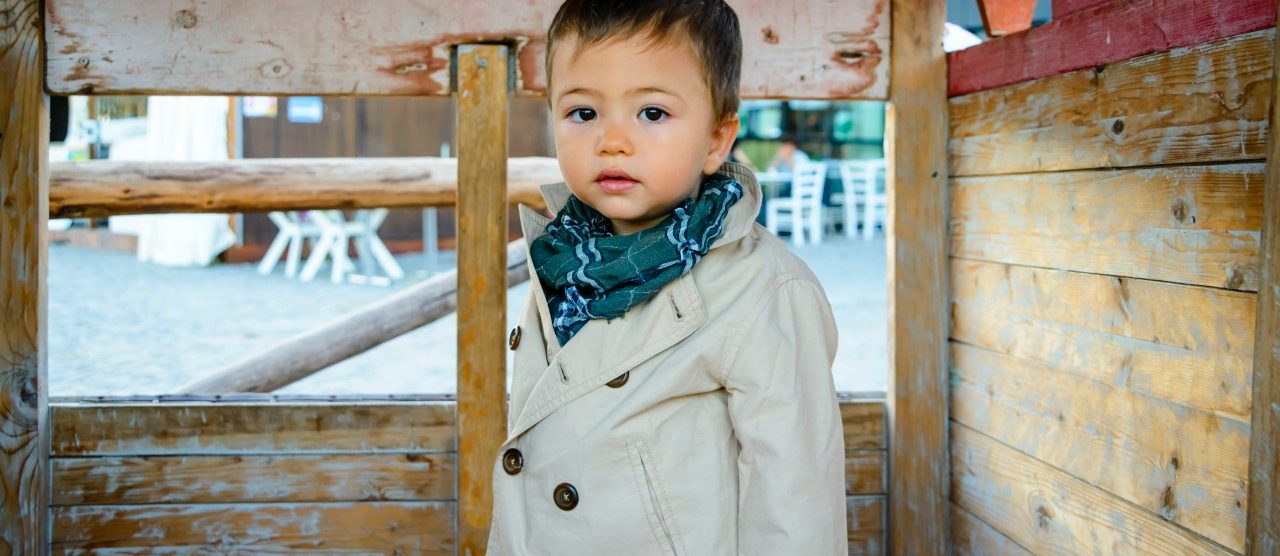 Portrait of Baby Boy in Wooden Play House --- Image by © Radius Images/Corbis