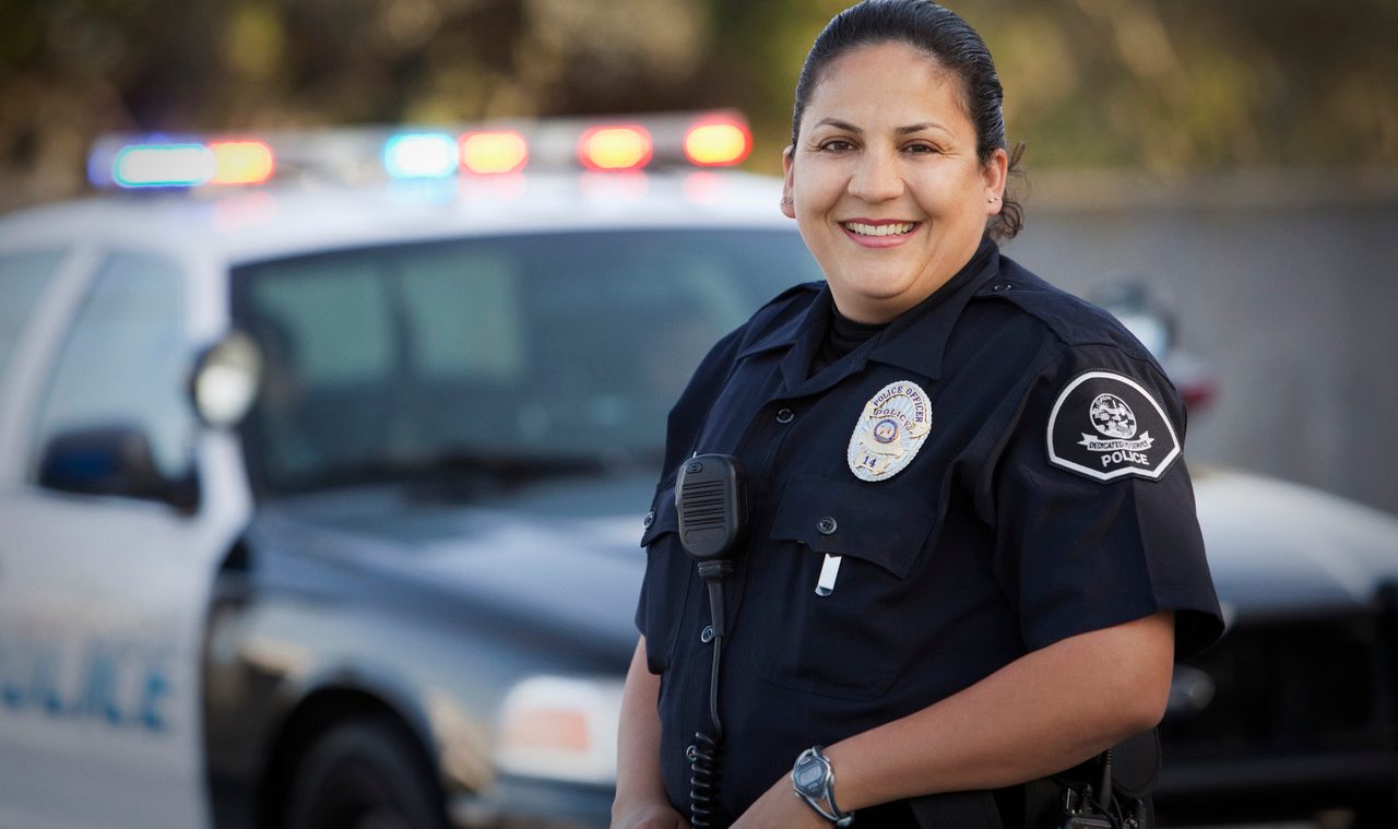 Hispanic policewoman --- Image by © Hill Street Studios/Blend Images/Corbis