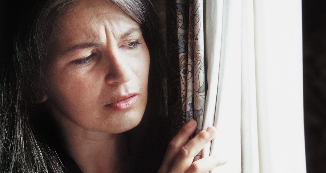 Peeking out the window --- Image by © Corbis