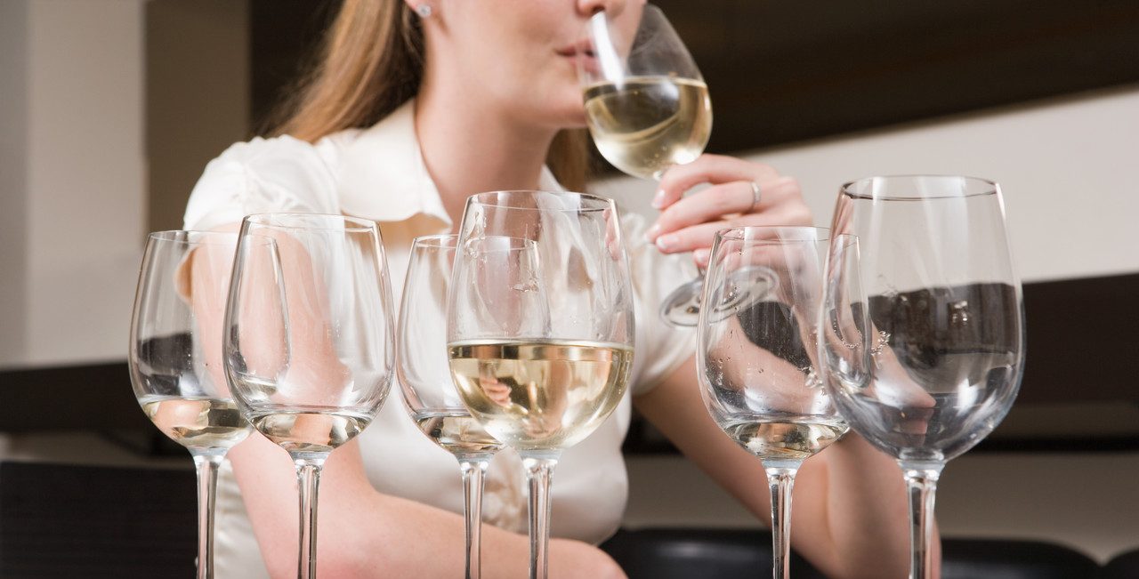 Woman binge drinking wine --- Image by © Image Source/Corbis