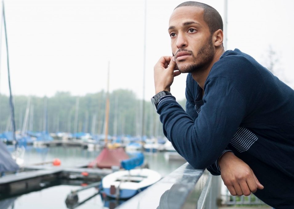 17 May 2013, Düsseldorf, Germany --- Portrait of young man in marina --- Image by © Attia-Fotografie/Corbis