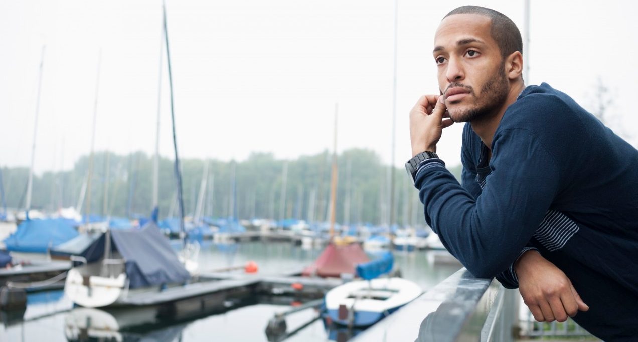 17 May 2013, Düsseldorf, Germany --- Portrait of young man in marina --- Image by © Attia-Fotografie/Corbis