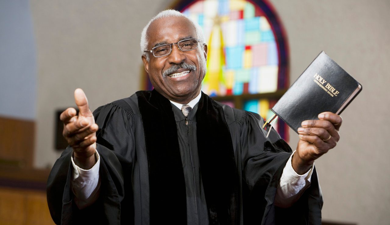 African American Reverend preaching in church --- Image by © Hill Street Studios/Blend Images/Corbis