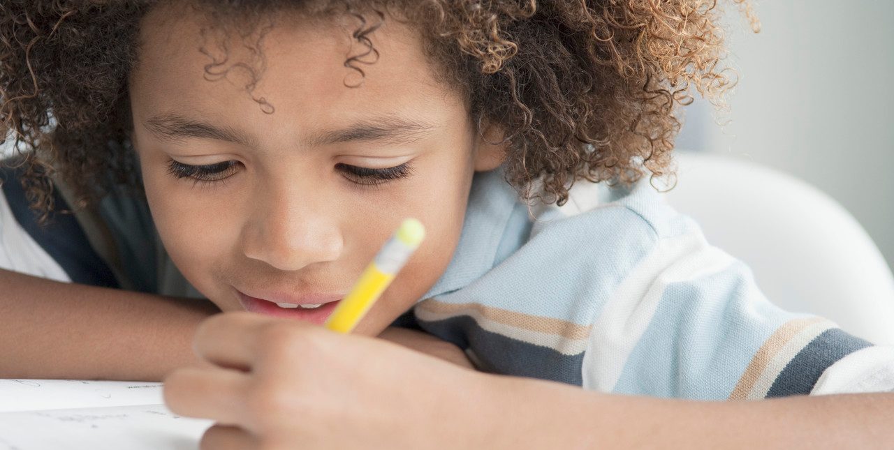 Little boy writing --- Image by © Beau Lark/Corbis