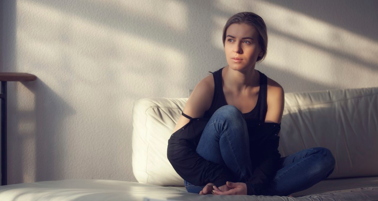 06 Dec 2014 --- Pensive alone woman at home --- Image by © 3photo/Corbis