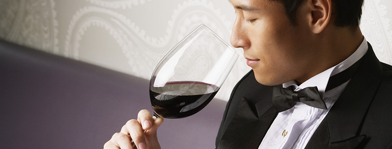 Man Drinking Red Wine --- Image by © Ken Seet/Corbis