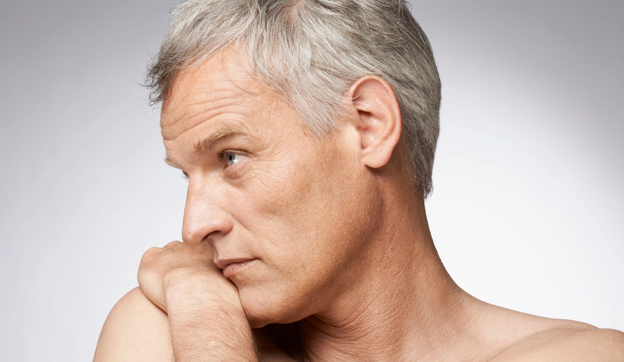 Man with pensive expression --- Image by © Mario Castello/Corbis