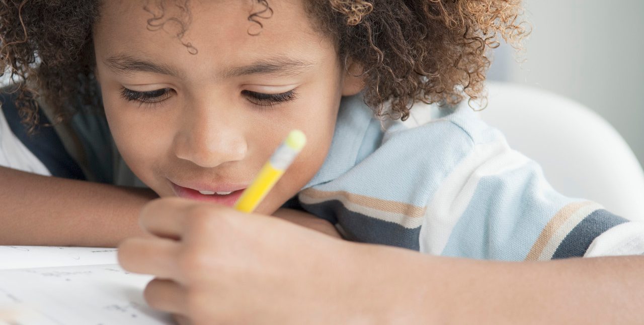 Little boy writing --- Image by © Beau Lark/Corbis