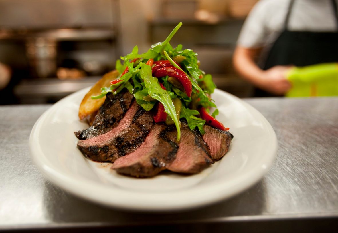 03 Dec 2010 --- USA, Montana, Sliced steak with salad --- Image by © Noah Clayton/Tetra Images/Corbis