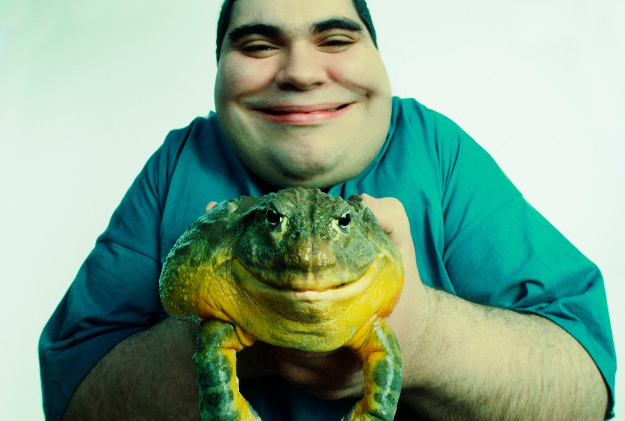 Man Holding a Smiling Toad --- Image by © Corbis