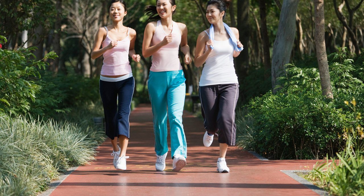 Young Women Power Walking --- Image by © Redlink Production/Corbis