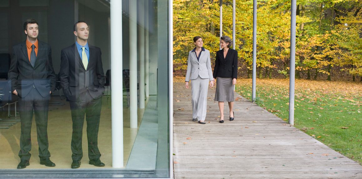 Businesswomen Walking Beside a Building --- Image by © Heide Benser/Corbis