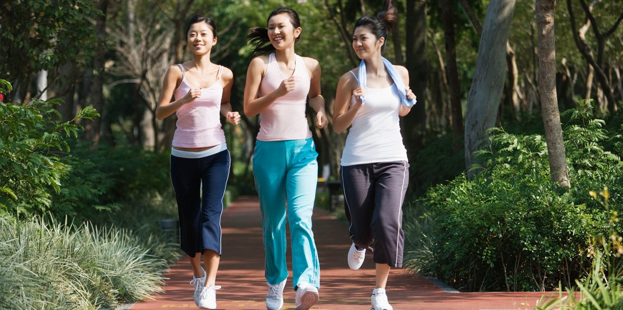 Young Women Power Walking --- Image by © Redlink Production/Corbis