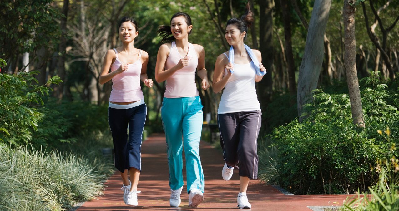 Young Women Power Walking --- Image by © Redlink Production/Corbis