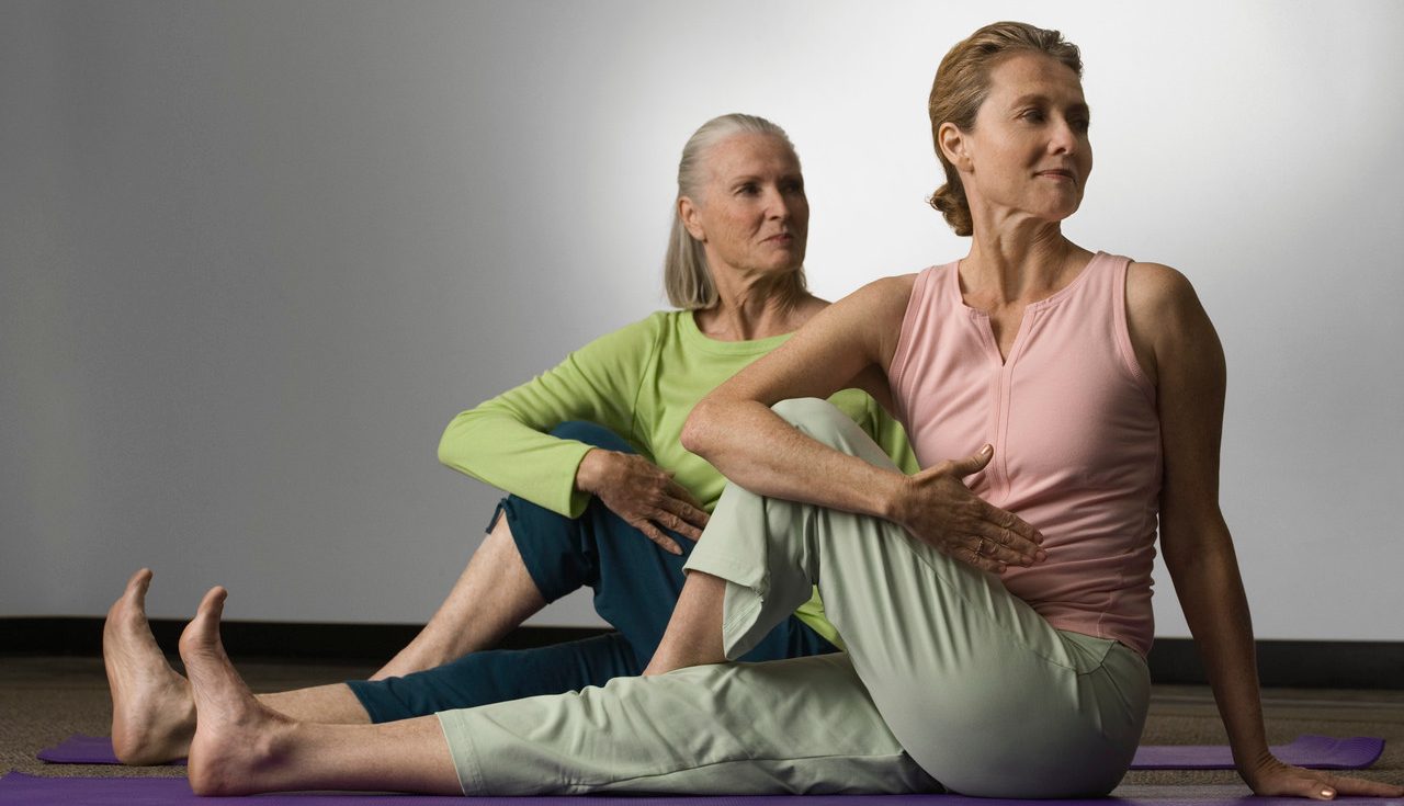 Women Doing Yoga --- Image by © Robert Michael/Corbis