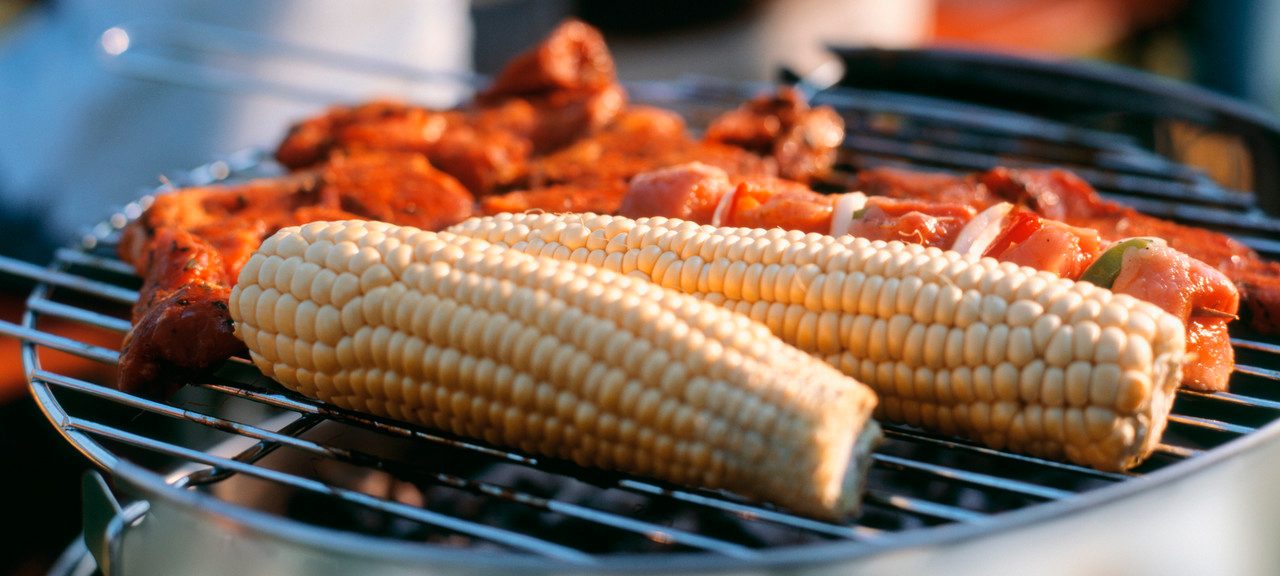 Corncobs and meat on grill --- Image by © Rainer Holz/Corbis