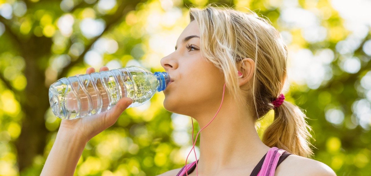 28 May 2014 --- Fit blonde drinking from her water bottle --- Image by © Wavebreak Media LTD/Wavebreak Media Ltd./Corbis