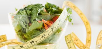 Bowl of salad and tape measure