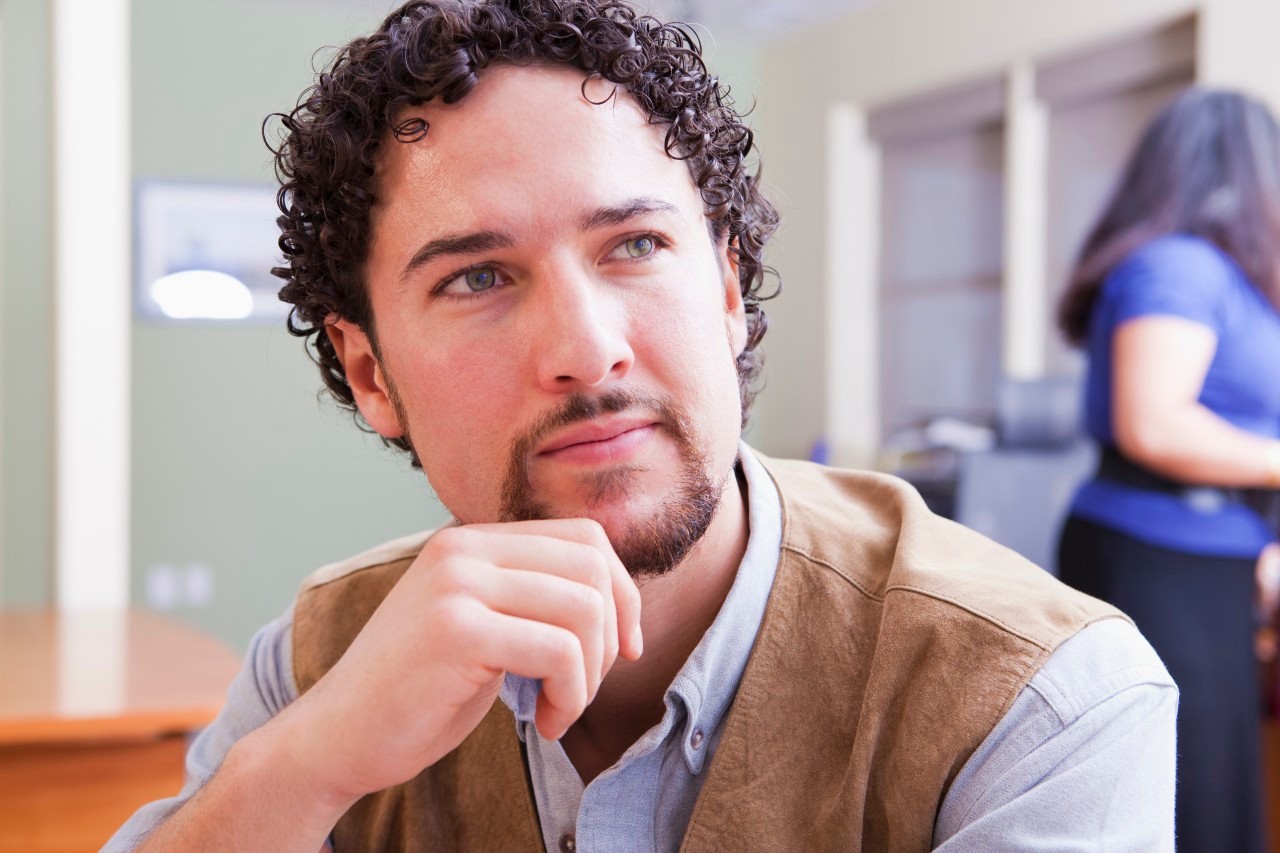 11 Jan 2012 --- Serious mixed race businessman in office --- Image by © John Lund/Marc Romanelli/Blend Images/Corbis