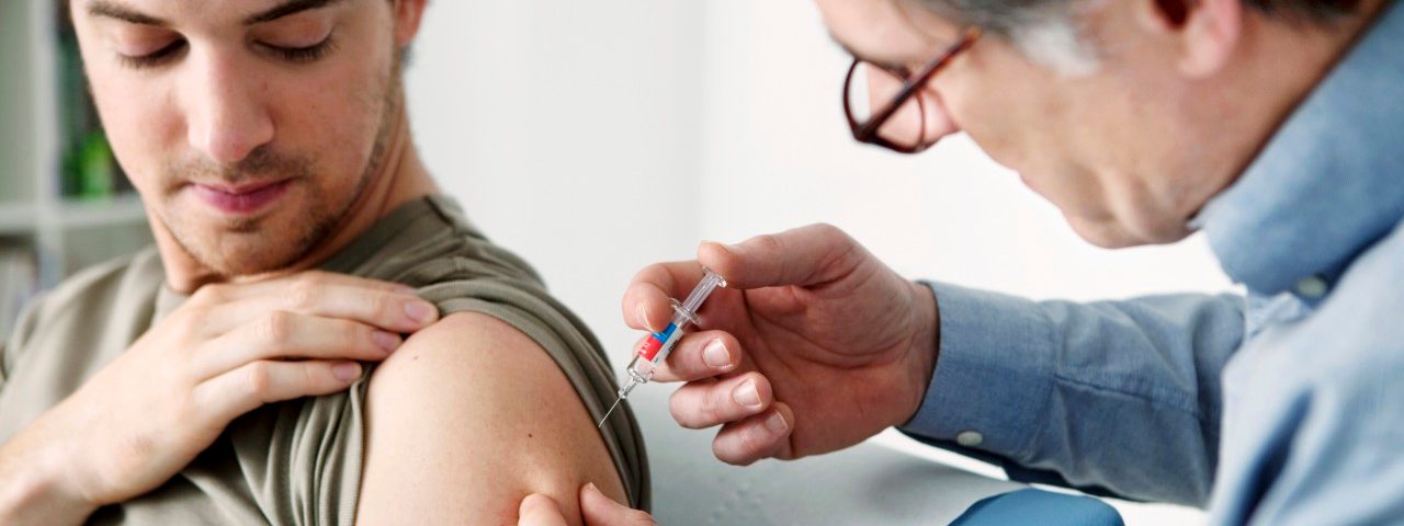 29 Jan 2013 --- Vaccinating a man --- Image by © B. Boissonnet/BSIP/Corbis