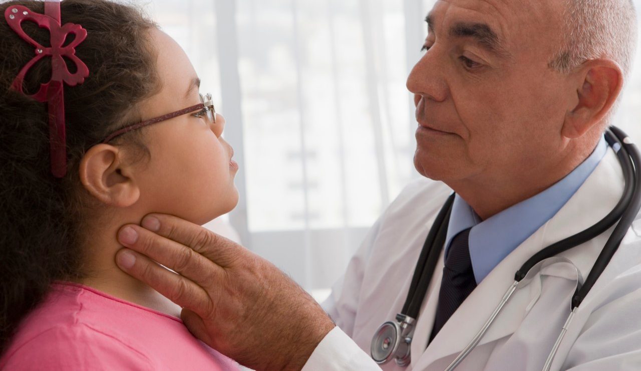 02 Jan 2013, Valparaíso Region, Chile --- Hispanic doctor checking patient's throat --- Image by © REB Images/Blend Images/Corbis