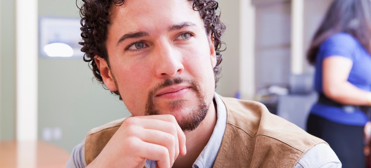 11 Jan 2012 --- Serious mixed race businessman in office --- Image by © John Lund/Marc Romanelli/Blend Images/Corbis