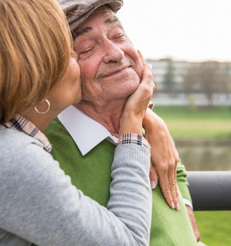 31 Oct 2014 --- Adult daughter kissing father's cheek --- Image by © Uwe Umstätter/Westend61/Corbis