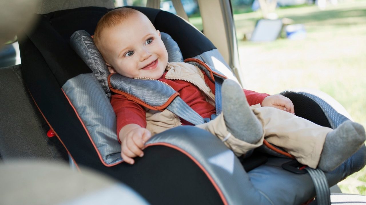 Baby boy in car seat --- Image by © Corbis