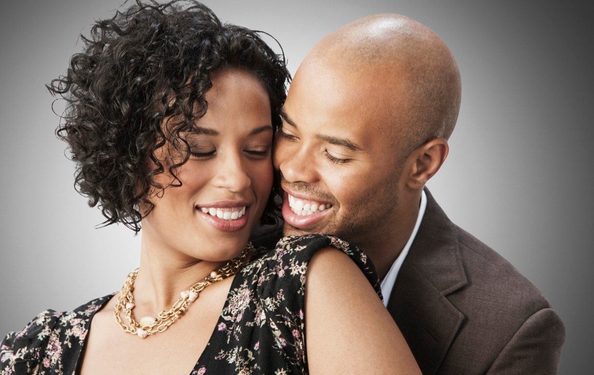 26 Sep 2012 --- Smiling mixed race couple hugging --- Image by © Jose Luis Pelaez Inc/Blend Images/Corbis