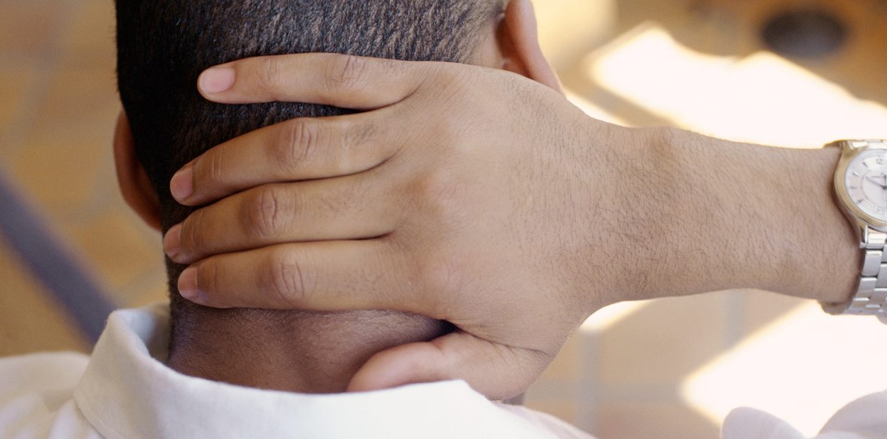 Man, Hand On Back Of Neck, Rear View, Close-up --- Image by © Vera Atchou/PhotoAlto/Corbis