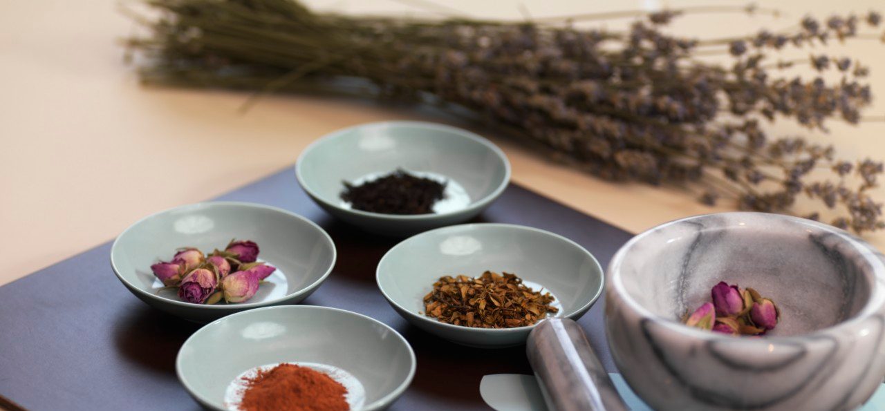 Mortar and Pestle with Dried Herbs --- Image by © Radius Images/Corbis