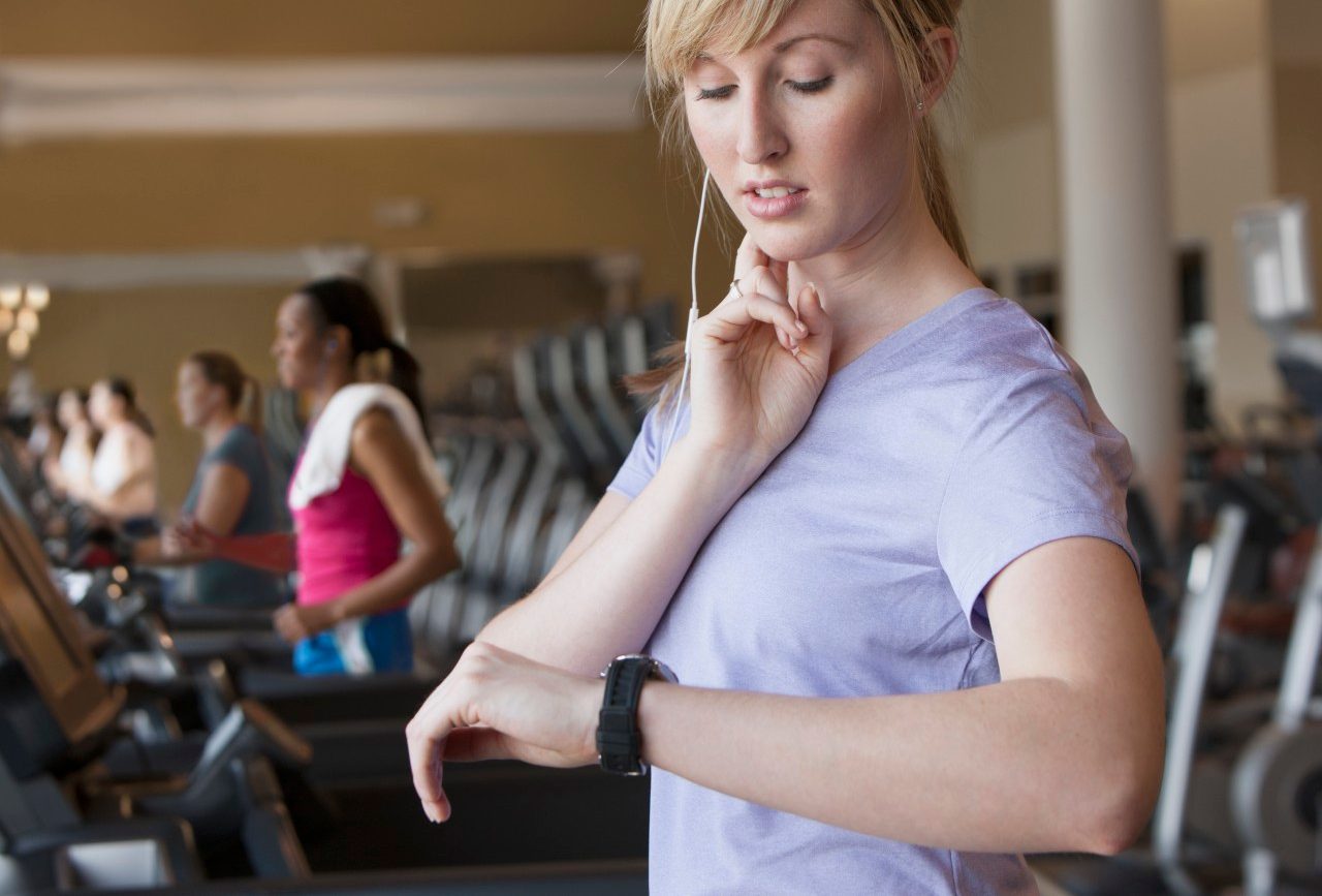 11 May 2012 --- Caucasian woman checking pulse in gym --- Image by © Jose Luis Pelaez Inc/Blend Images/Corbis