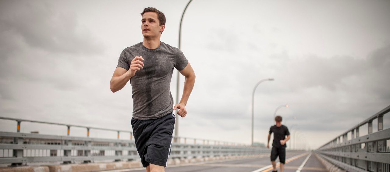 05 Jun 2014 --- Young men jogging --- Image by © Charles Knox/Corbis