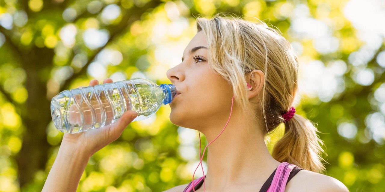 28 May 2014 --- Fit blonde drinking from her water bottle --- Image by © Wavebreak Media LTD/Wavebreak Media Ltd./Corbis