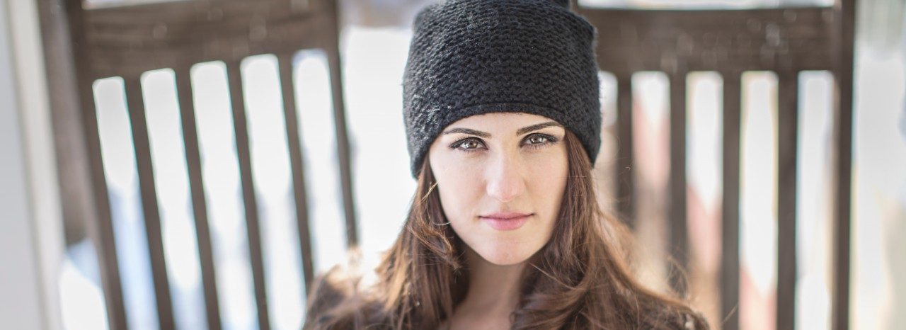 02 Mar 2015 --- Portrait of young woman wearing knit hat --- Image by © Steve Prezant/Corbis