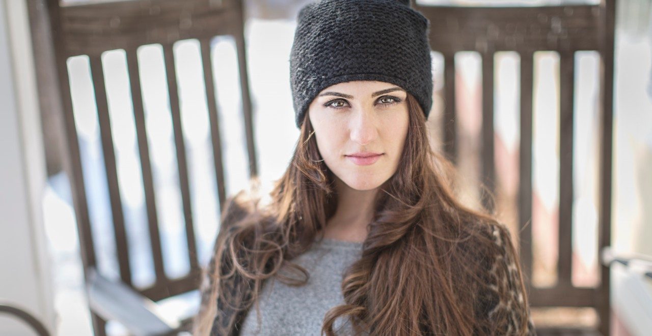 02 Mar 2015 --- Portrait of young woman wearing knit hat --- Image by © Steve Prezant/Corbis